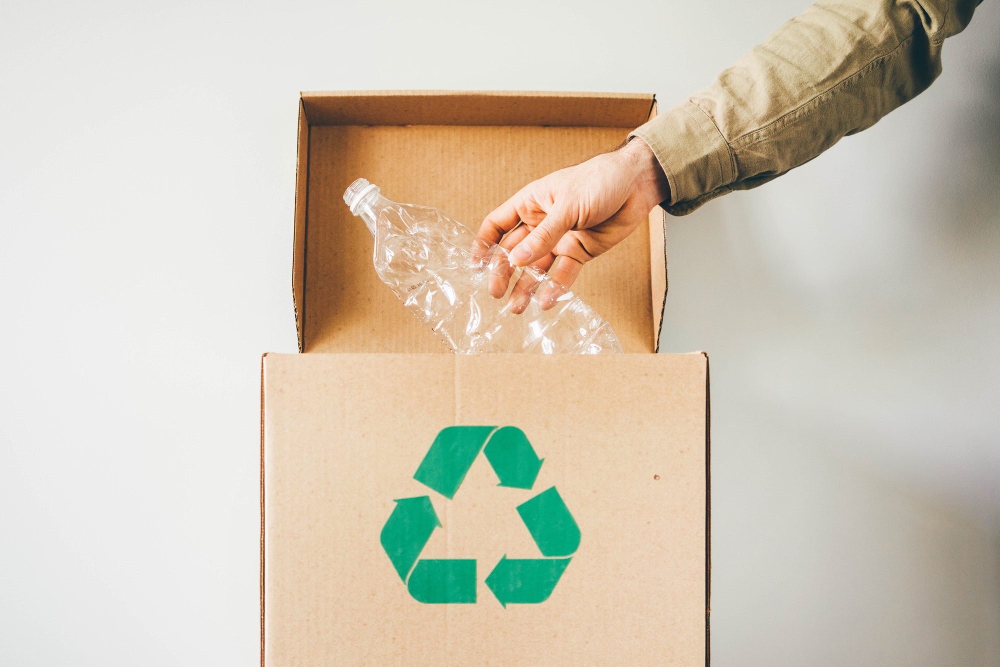 throw-plastic-bottle-into-the-recycling-box-.jpg